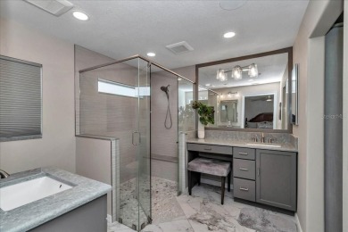 Step inside and be greeted by sweeping golf course views from on Summerglen Country Club in Florida - for sale on GolfHomes.com, golf home, golf lot