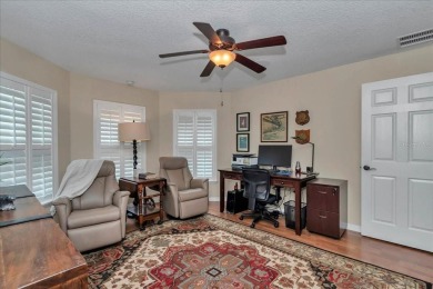 Step inside and be greeted by sweeping golf course views from on Summerglen Country Club in Florida - for sale on GolfHomes.com, golf home, golf lot