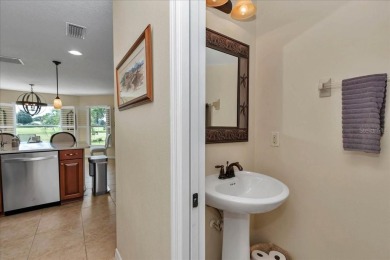 Step inside and be greeted by sweeping golf course views from on Summerglen Country Club in Florida - for sale on GolfHomes.com, golf home, golf lot
