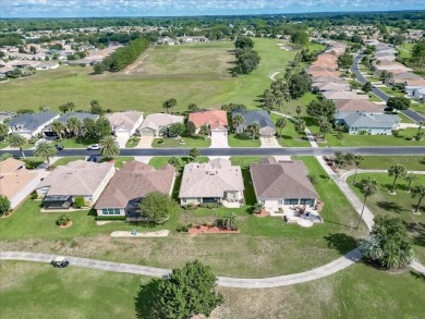 Step inside and be greeted by sweeping golf course views from on Summerglen Country Club in Florida - for sale on GolfHomes.com, golf home, golf lot