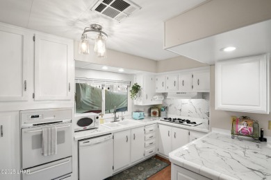 Step inside this mobile home that's been thoughtfully updated on The Refuge Golf and Country Club in Arizona - for sale on GolfHomes.com, golf home, golf lot