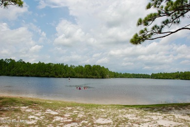 Take a look at this .24-acre wooded lot in the community of on The Lakes Country Club in North Carolina - for sale on GolfHomes.com, golf home, golf lot