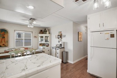 Step inside this mobile home that's been thoughtfully updated on The Refuge Golf and Country Club in Arizona - for sale on GolfHomes.com, golf home, golf lot