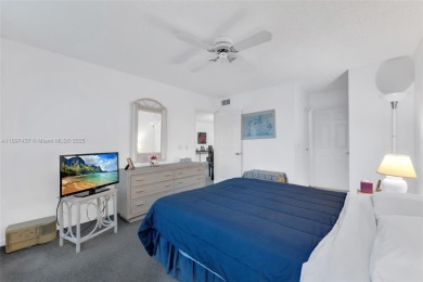 Experience effortless elegance in this first-floor 2-bedroom on Sunrise Lakes Phase IV Golf Course in Florida - for sale on GolfHomes.com, golf home, golf lot