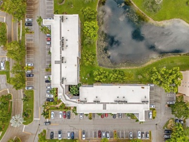 Experience effortless elegance in this first-floor 2-bedroom on Sunrise Lakes Phase IV Golf Course in Florida - for sale on GolfHomes.com, golf home, golf lot