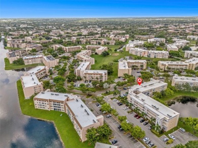 Experience effortless elegance in this first-floor 2-bedroom on Sunrise Lakes Phase IV Golf Course in Florida - for sale on GolfHomes.com, golf home, golf lot