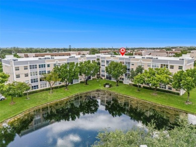 Experience effortless elegance in this first-floor 2-bedroom on Sunrise Lakes Phase IV Golf Course in Florida - for sale on GolfHomes.com, golf home, golf lot