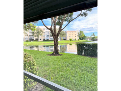 Experience effortless elegance in this first-floor 2-bedroom on Sunrise Lakes Phase IV Golf Course in Florida - for sale on GolfHomes.com, golf home, golf lot