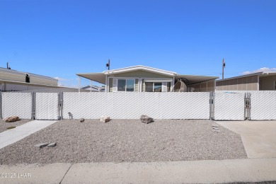 Step inside this mobile home that's been thoughtfully updated on The Refuge Golf and Country Club in Arizona - for sale on GolfHomes.com, golf home, golf lot