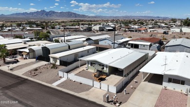Step inside this mobile home that's been thoughtfully updated on The Refuge Golf and Country Club in Arizona - for sale on GolfHomes.com, golf home, golf lot