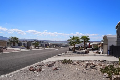Step inside this mobile home that's been thoughtfully updated on The Refuge Golf and Country Club in Arizona - for sale on GolfHomes.com, golf home, golf lot