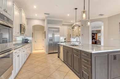 Nestled at the end of a peaceful cul-de-sac in the exclusive on Legacy Golf Club in Florida - for sale on GolfHomes.com, golf home, golf lot