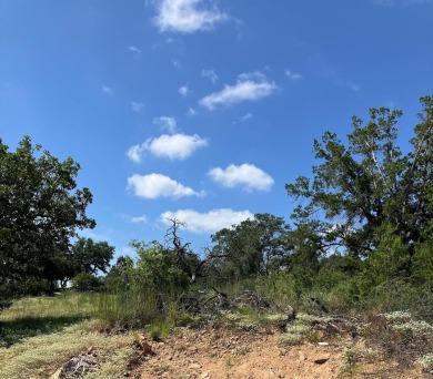 This oversized lot offers elevated views of the surrounding hill on Ram Rock Golf Course in Texas - for sale on GolfHomes.com, golf home, golf lot
