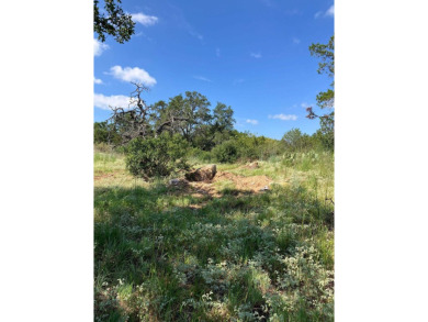 This oversized lot offers elevated views of the surrounding hill on Ram Rock Golf Course in Texas - for sale on GolfHomes.com, golf home, golf lot