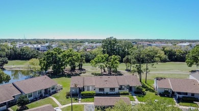 Enjoy the carefree Florida lifestyle in this 2-bedroom, 2-bath on East Lake Woodlands Country Club in Florida - for sale on GolfHomes.com, golf home, golf lot