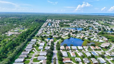 This open and spacious 2 bdrm/ 2 bath home features laminate & on Savanna Golf Club in Florida - for sale on GolfHomes.com, golf home, golf lot