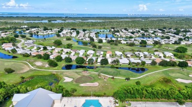 This open and spacious 2 bdrm/ 2 bath home features laminate & on Savanna Golf Club in Florida - for sale on GolfHomes.com, golf home, golf lot