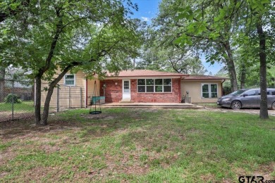Welcome to your serene retreat in the gated community of on Hide-A-Way Lake Golf Course in Texas - for sale on GolfHomes.com, golf home, golf lot