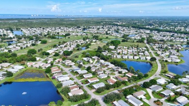 This open and spacious 2 bdrm/ 2 bath home features laminate & on Savanna Golf Club in Florida - for sale on GolfHomes.com, golf home, golf lot