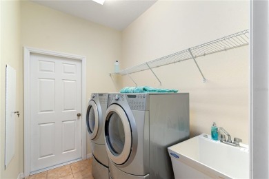 This beautiful home is the Huntley 11 EXP Model with 2635 SQ FT on Candler Hills Golf and Country Club in Florida - for sale on GolfHomes.com, golf home, golf lot