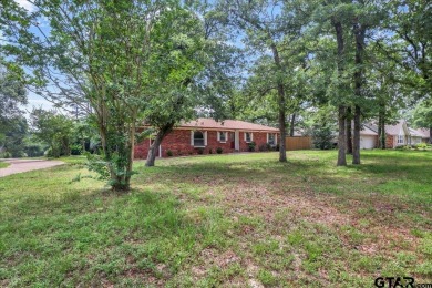 Welcome to your serene retreat in the gated community of on Hide-A-Way Lake Golf Course in Texas - for sale on GolfHomes.com, golf home, golf lot