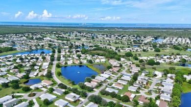 This open and spacious 2 bdrm/ 2 bath home features laminate & on Savanna Golf Club in Florida - for sale on GolfHomes.com, golf home, golf lot