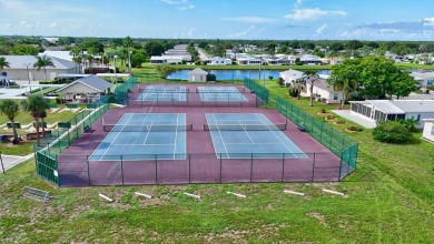 This open and spacious 2 bdrm/ 2 bath home features laminate & on Savanna Golf Club in Florida - for sale on GolfHomes.com, golf home, golf lot