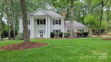 Experience luxury living in one of South Charlotte's most on Raintree Country Club in North Carolina - for sale on GolfHomes.com, golf home, golf lot