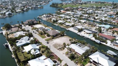 Here is your perfect chance to build your dream waterfront home on Key Royale Club in Florida - for sale on GolfHomes.com, golf home, golf lot