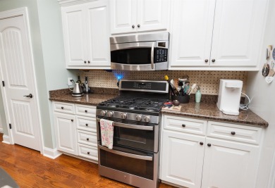 Nestled in the sought-after Woodfin Ridge Golf Course community on Woodfin Ridge Golf Club in South Carolina - for sale on GolfHomes.com, golf home, golf lot