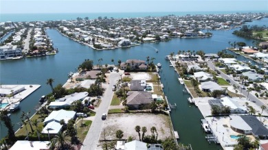 Here is your perfect chance to build your dream waterfront home on Key Royale Club in Florida - for sale on GolfHomes.com, golf home, golf lot