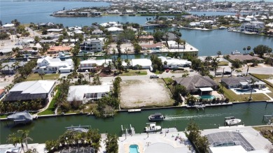 Here is your perfect chance to build your dream waterfront home on Key Royale Club in Florida - for sale on GolfHomes.com, golf home, golf lot