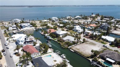Here is your perfect chance to build your dream waterfront home on Key Royale Club in Florida - for sale on GolfHomes.com, golf home, golf lot