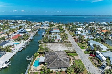 Here is your perfect chance to build your dream waterfront home on Key Royale Club in Florida - for sale on GolfHomes.com, golf home, golf lot