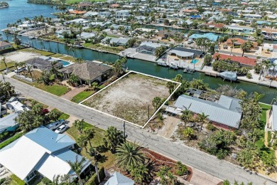 Here is your perfect chance to build your dream waterfront home on Key Royale Club in Florida - for sale on GolfHomes.com, golf home, golf lot