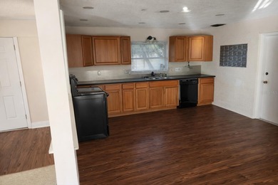 Welcome to this charming residence located at 2421 Archer Blvd on Wedgefield Golf Club in Florida - for sale on GolfHomes.com, golf home, golf lot