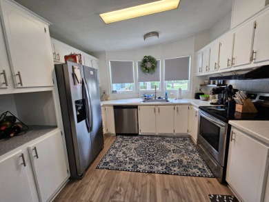 This home is located on leased land in a 55+ resort-style MH on Big Cypress Golf and Country Club in Florida - for sale on GolfHomes.com, golf home, golf lot