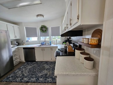This home is located on leased land in a 55+ resort-style MH on Big Cypress Golf and Country Club in Florida - for sale on GolfHomes.com, golf home, golf lot