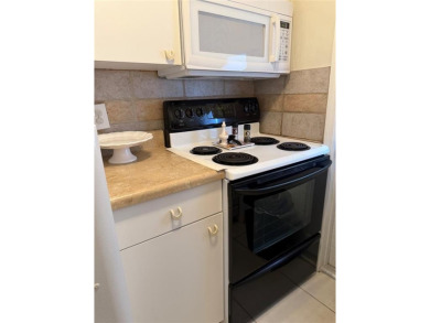 Beautifully maintained 2-bedroom, 1-bath first-floor condo with on Leisureville Community Association in Florida - for sale on GolfHomes.com, golf home, golf lot