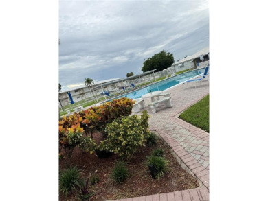 Beautifully maintained 2-bedroom, 1-bath first-floor condo with on Leisureville Community Association in Florida - for sale on GolfHomes.com, golf home, golf lot