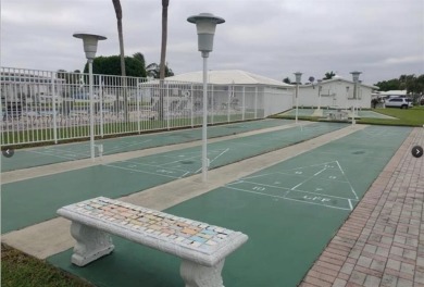 Beautifully maintained 2-bedroom, 1-bath first-floor condo with on Leisureville Community Association in Florida - for sale on GolfHomes.com, golf home, golf lot