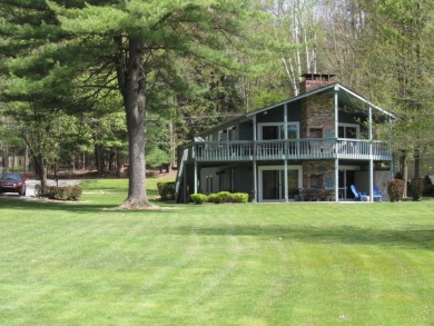 Lake house with a large level lot for outdoor enjoyment for sale on GolfHomes.com