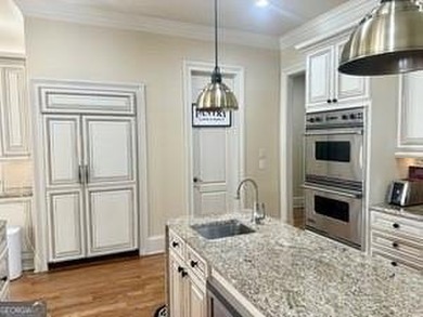 INSTANT EQUITY! Here lies a rare blend of comfort design waiting on The Governors Towne Club in Georgia - for sale on GolfHomes.com, golf home, golf lot