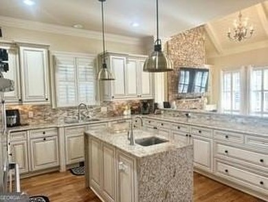 INSTANT EQUITY! Here lies a rare blend of comfort design waiting on The Governors Towne Club in Georgia - for sale on GolfHomes.com, golf home, golf lot