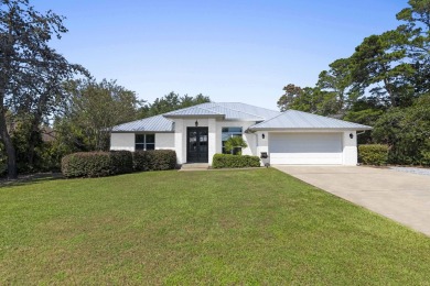 Nestled on an oversized lot, this single-level brick home in on Santa Rosa Golf and Beach Club in Florida - for sale on GolfHomes.com, golf home, golf lot