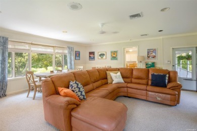 Spacious home with a large living room featuring a wood-burning on National Golf Links of America in New York - for sale on GolfHomes.com, golf home, golf lot