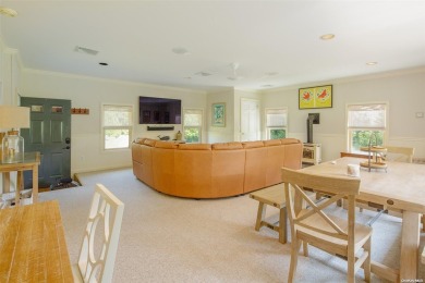 Spacious home with a large living room featuring a wood-burning on National Golf Links of America in New York - for sale on GolfHomes.com, golf home, golf lot