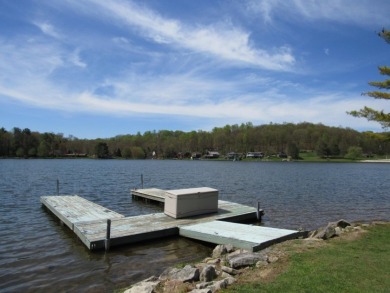 Lake house with a large level lot for outdoor enjoyment on Treasure Lake - Silver in Pennsylvania - for sale on GolfHomes.com, golf home, golf lot