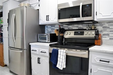 Step into luxury with this exquisite 1-bedroom, 1.5-bathroom on Palm-Aire Country Club and Resort - Palms in Florida - for sale on GolfHomes.com, golf home, golf lot