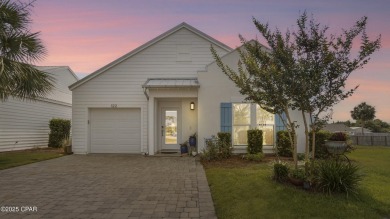This like-new beach retreat in the quiet gated community of on Camp Creek Golf Course in Florida - for sale on GolfHomes.com, golf home, golf lot
